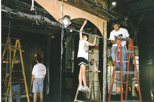 Stage Coach Players Mark Hunyard and Bob Cain help prepare the stage lighting.